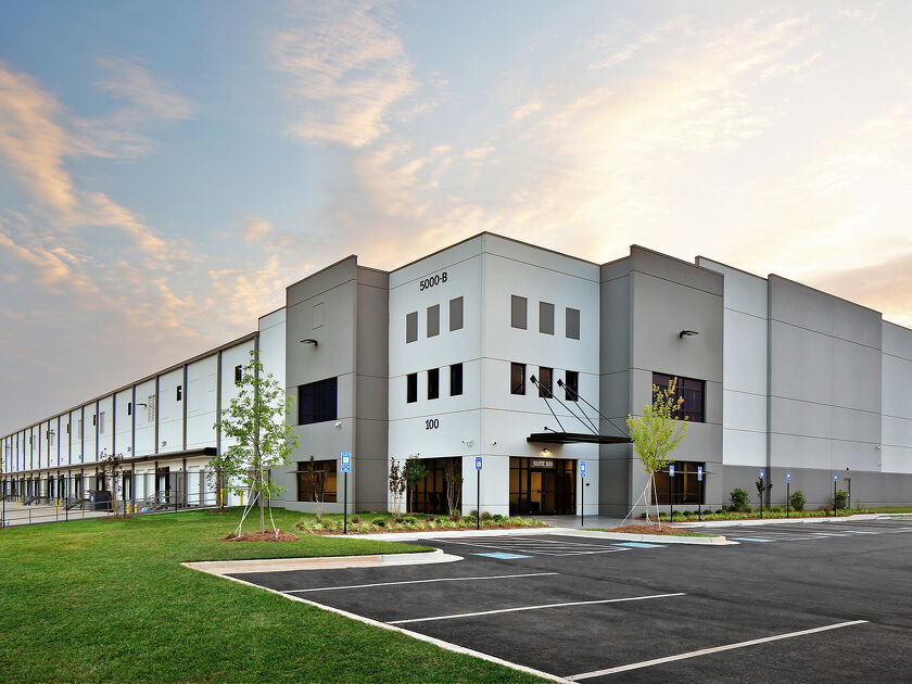 Modern commercial building with office space and parking area